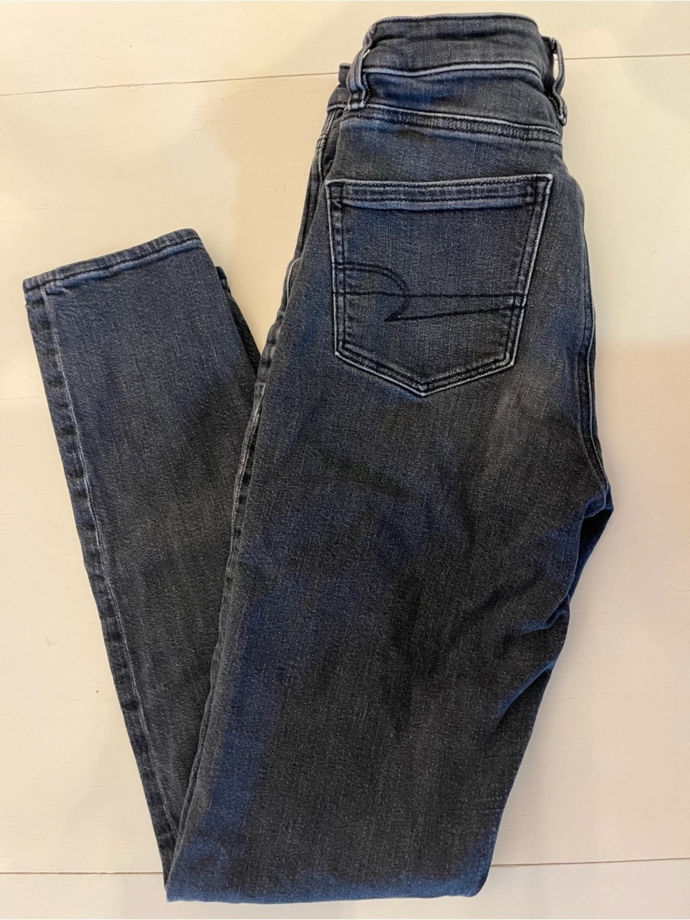 American Eagle High-waisted dark wash strigid jeans size US 00 long